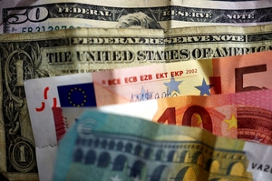 news image for Dollar slips as bets mount for less hawkish Fed, euro above parity
